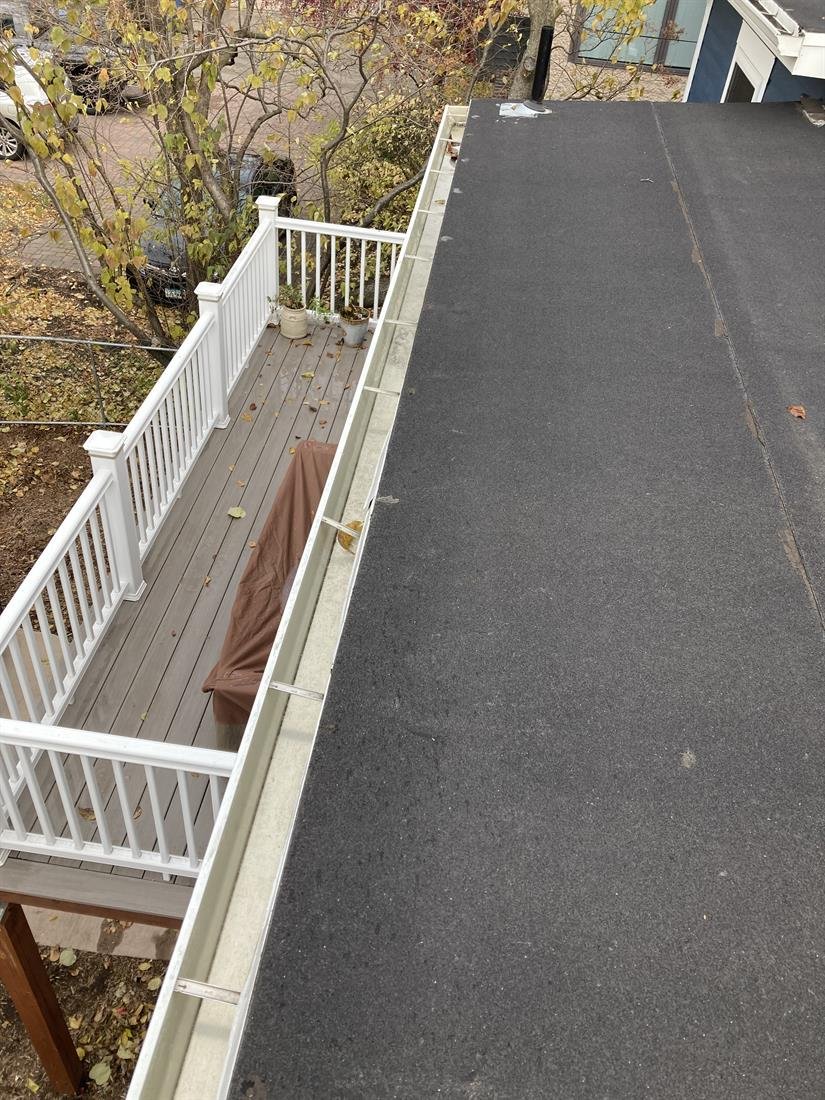The same gutter above the deck emptied and rinsed clean