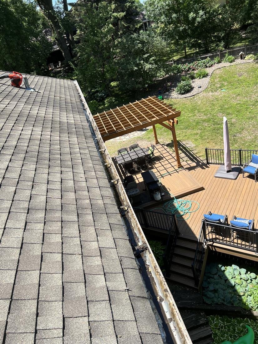 The same gutter above the backyard deck scraped out and clean
