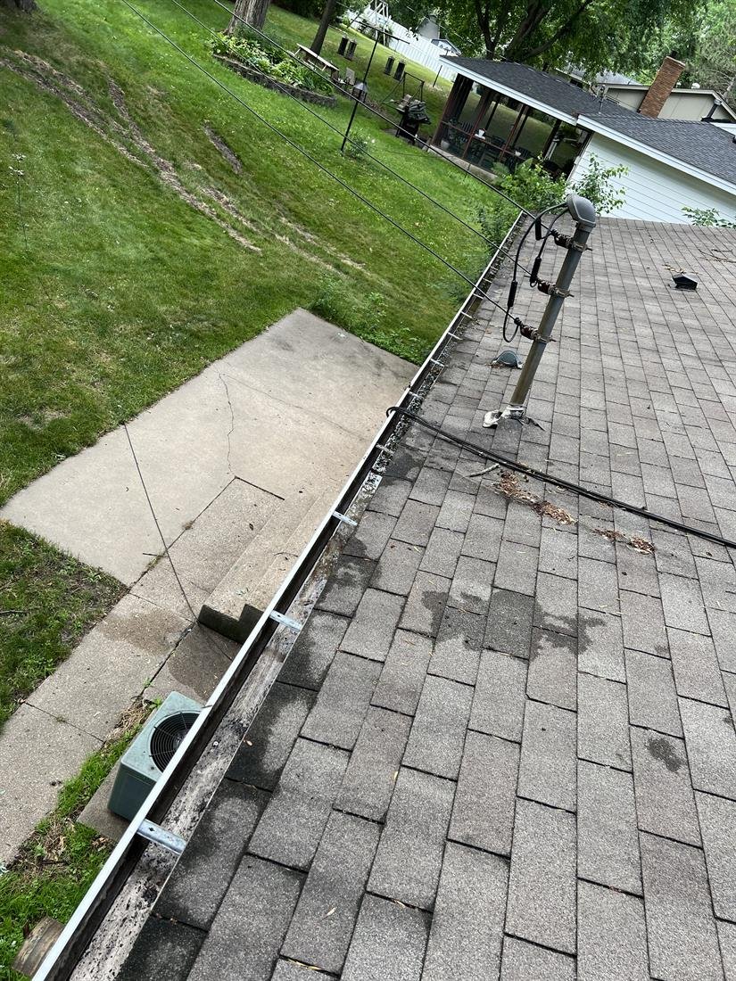 The same gutter cleared of weeds and washed out