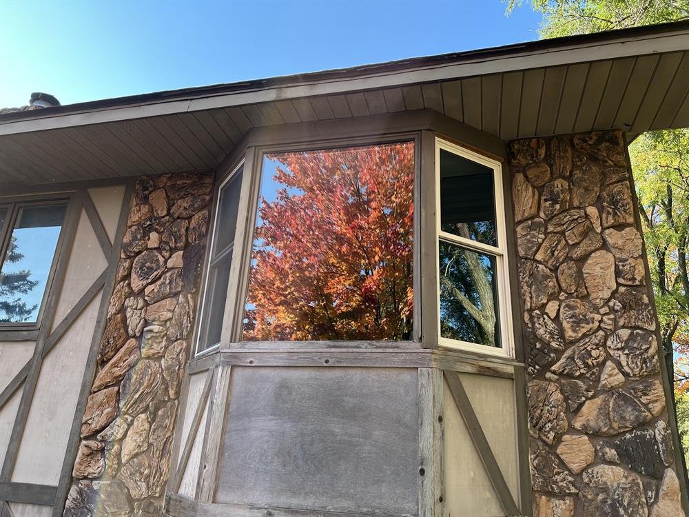 Freshly cleaned windows on a north metro home reflecting autumn color